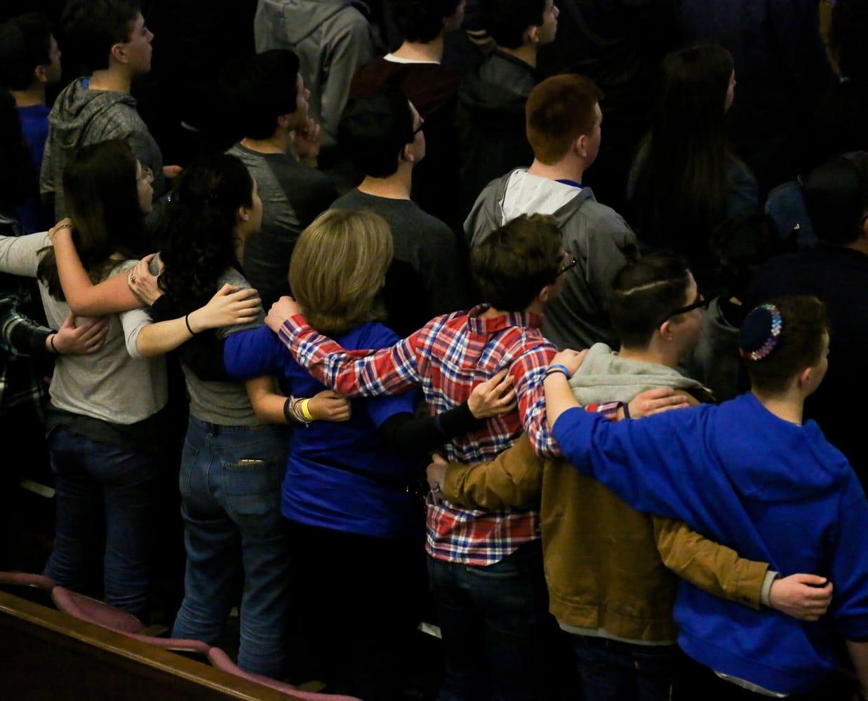 attendees arm in arm