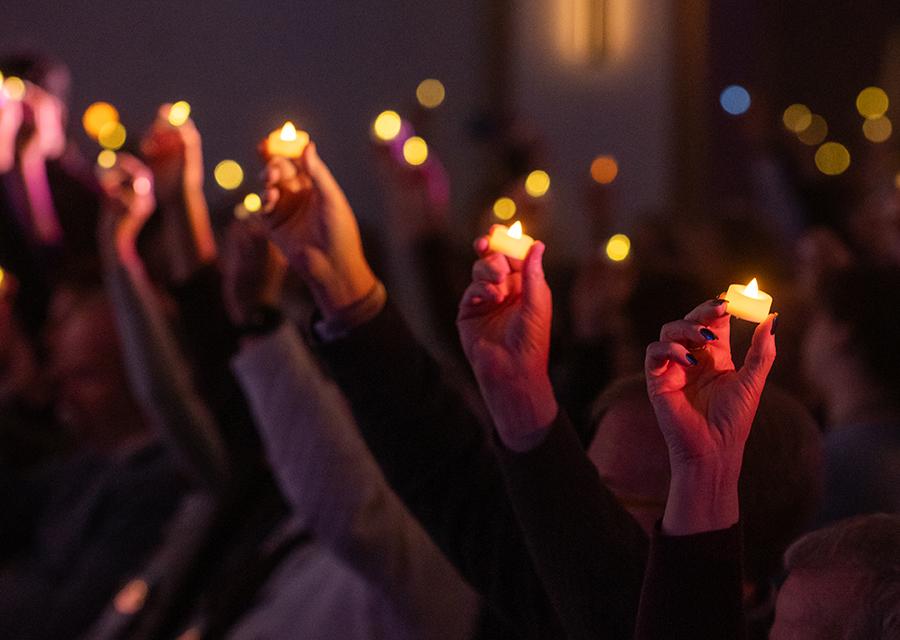 holding hanukkah candles aloft